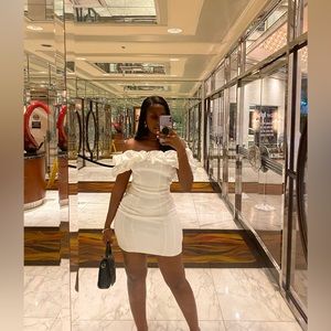 A beautiful off the shoulder, white mini dress. Size 6 or medium.